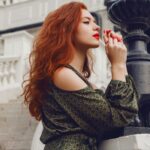 romantic portrait of elegant ginger woman in green JTSWWT8